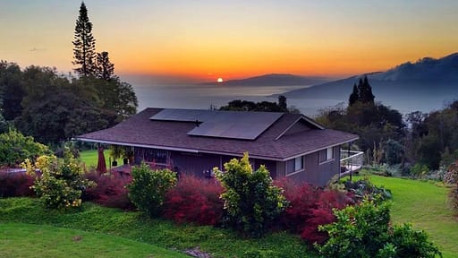 Rising Sun Solar Home on Kauai with sun rising in background