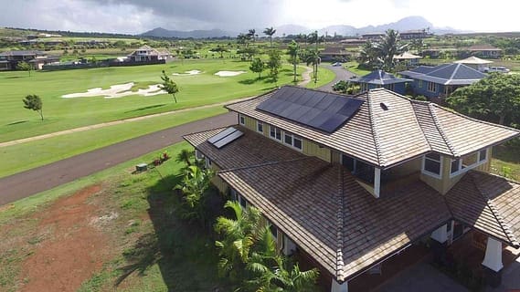 Home next to golf course with solar panels installed by rising sun solar Maui