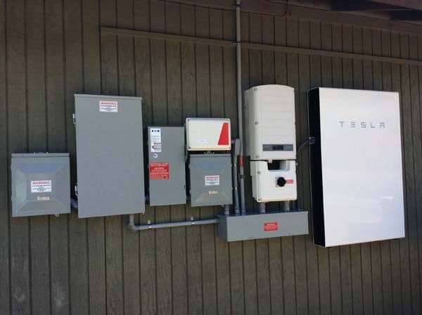 picture of a tesla powerwalls and inverter installed by rising sun solar hawaii
