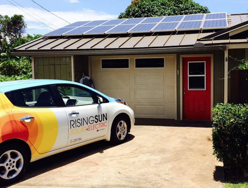 rising sun service car and a house with solar panel installed on the roof